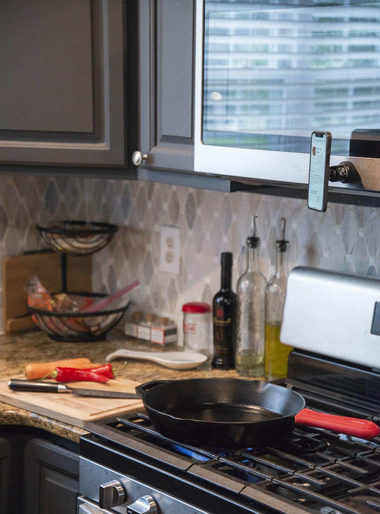 phone mounted on to MobNetic Maxx inside kitchen while cooking