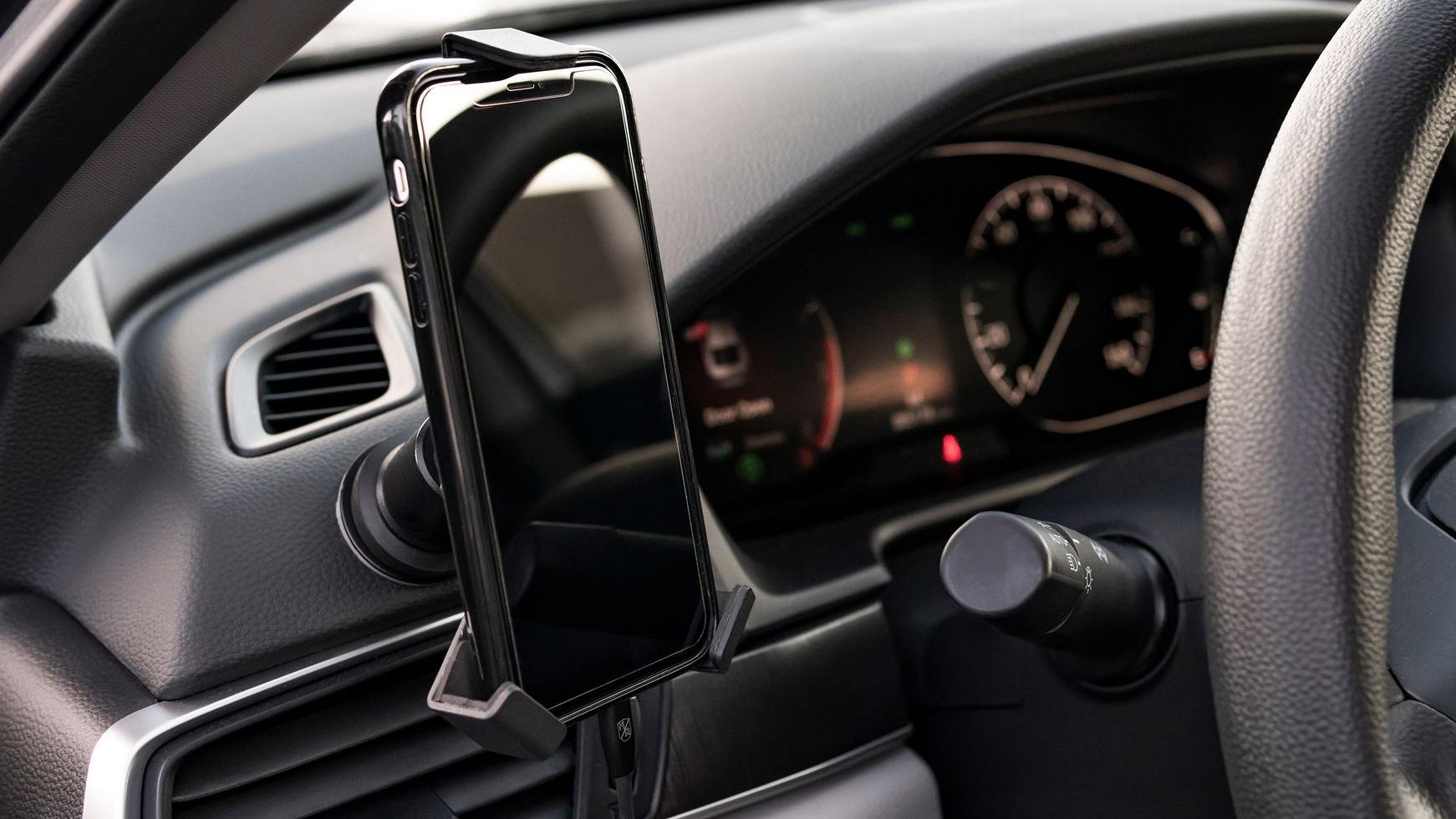 phone mounted to Mob Mount on car dashboard