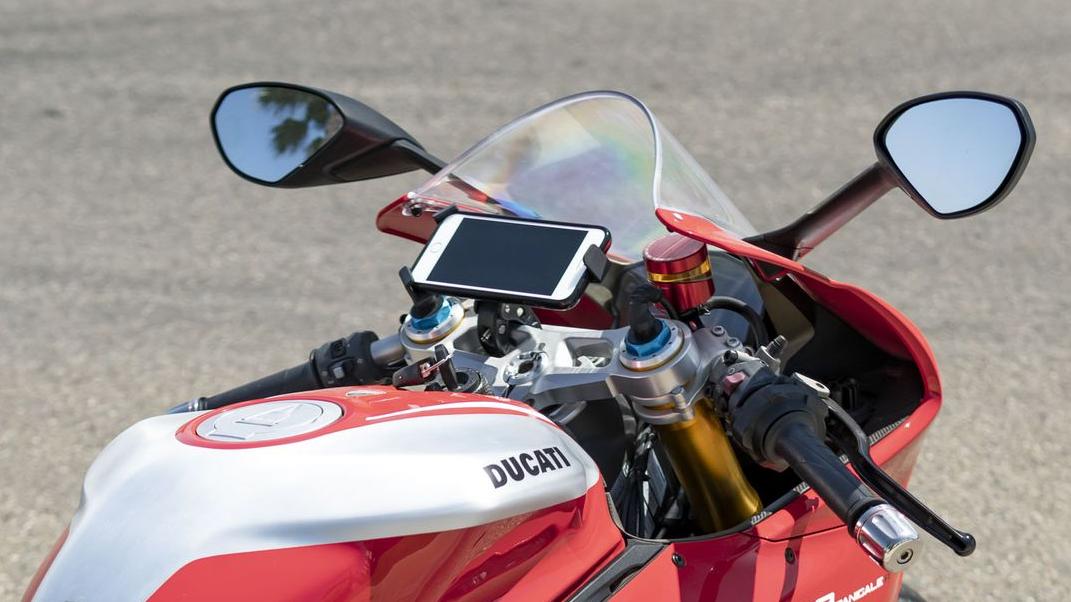 phone mounted to motorcycle handlebars with Mob Mount Claw